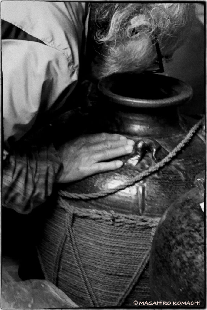 Awamori hermit sniffs a jar